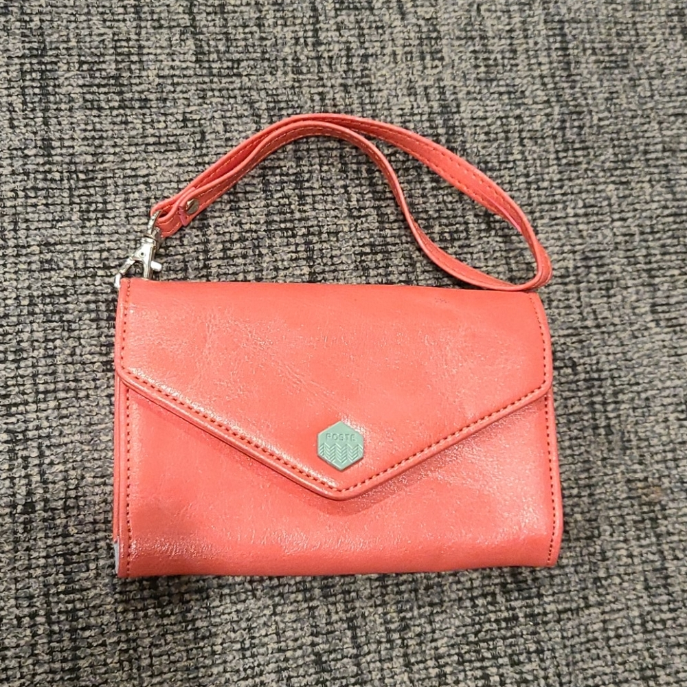 Created by iconic coral leather wristlet
